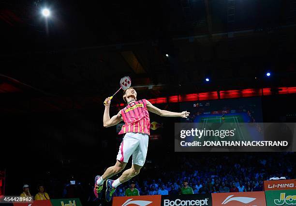 Malaysia's Lee Chong Wei plays against China's Chen Long during the men's single final match at the 2014 BWF Badminton World championships held at...