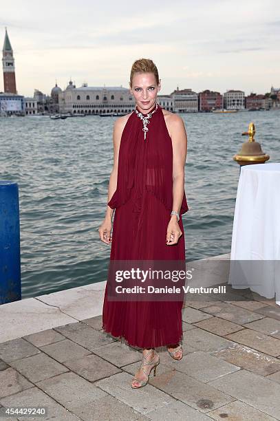 Uma Thurman attends the Chopard And Vanity Fair Present 'Backstage At Cinecitta' Exhibition - Red Carpet - 71st Venice Film Festival at Cipriani...