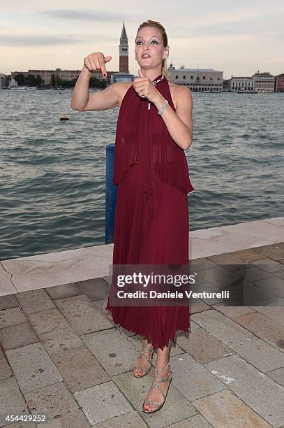 Uma Thurman attends the Chopard And Vanity Fair Present 'Backstage At Cinecitta' Exhibition - Red Carpet - 71st Venice Film Festival at Cipriani...