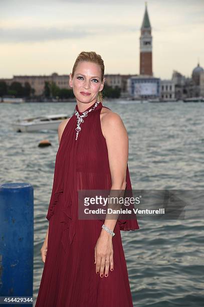 Uma Thurman attends the Chopard And Vanity Fair Present 'Backstage At Cinecitta' Exhibition - Red Carpet - 71st Venice Film Festival at Cipriani...