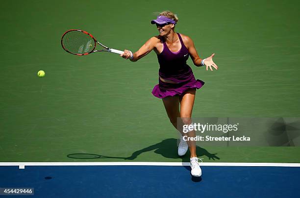 Mirjana Lucic-Baroni of Croatia returns a shot to Sara Errani of Italy during their women's singles fourth round match on Day Seven of the 2014 US...