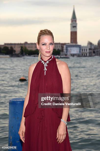 Uma Thurman attends the Chopard And Vanity Fair Present 'Backstage At Cinecitta' Exhibition - Red Carpet - 71st Venice Film Festival at Cipriani...