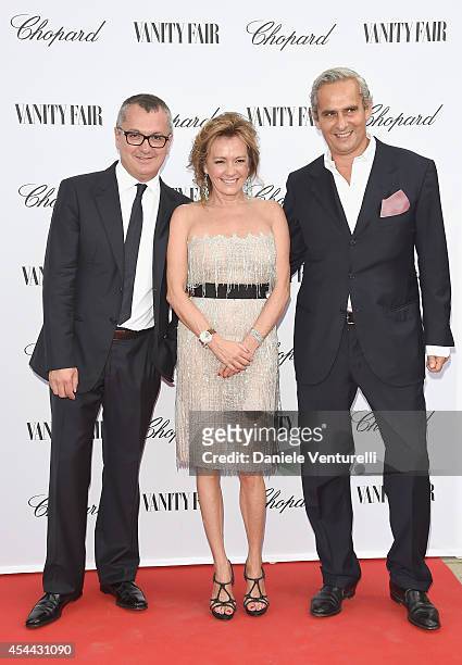 Luca Dini and Caroline Scheufele attend the Chopard And Vanity Fair Present 'Backstage At Cinecitta' Exhibition - Red Carpet - 71st Venice Film...