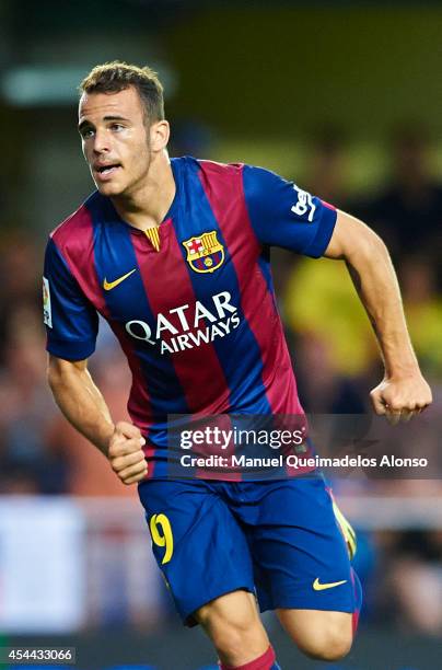 Sandro of Barcelona celebrates after scoring during the La Liga match between Villarreal CF and FC Barcelona at El Madrigal stadium on August 31,...