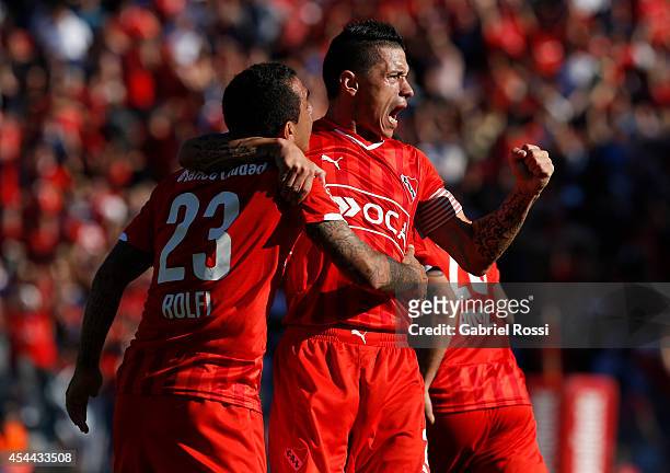 Daniel Montenegro and Cristian Tula of Independiente celebrates after Federico Mancuello scored the second goal against Racing during a match between...