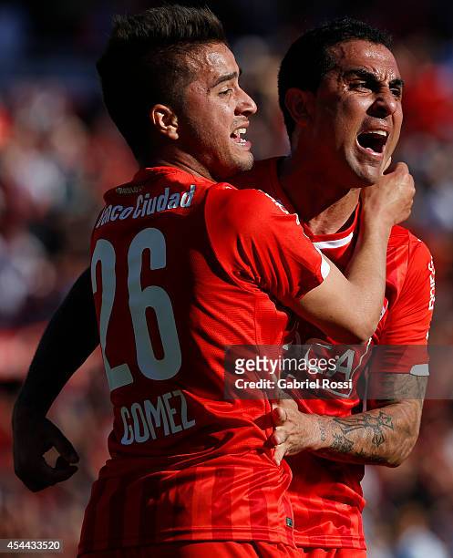 Daniel Montenegro and Rodrigo Gomez of Independiente celebrates after Federico Mancuello scored the second goal against Racing during a match between...