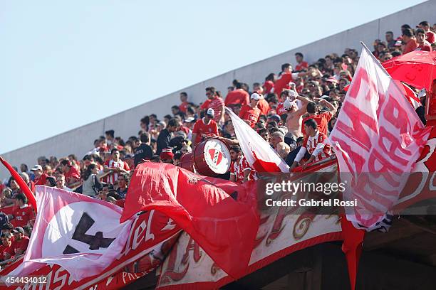 Fans of Independiente cheer for their team prior a match between Independiente and Racing as part of fifth round of Torneo de Transicion 2014 at...
