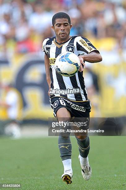 Junior Cesar of Botafogo runs with the ball during the match between Botafogo and Santos as part of Brasileirao Series A 2014 at Maracana stadium on...