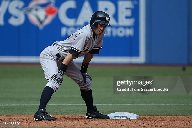 Ichiro Suzuki of the New York Yankees pinch runs for Jacoby Ellsbury at second base in the ninth inning during MLB game action against the Toronto...