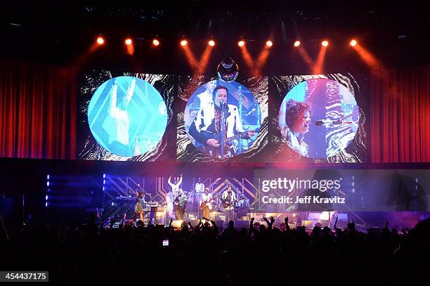 Musical group Arcade Fire performs onstage at the 24th Annual KROQ Almost Acoustic Christmas at The Shrine Auditorium on December 8, 2013 in Los...