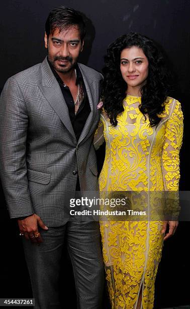Indian bollywood actors Kajol and Ajay Devgn pose for their profile shoot at Taj Palace Hotel on December 6, 2013 in New Delhi, India. Kajol and Ajay...