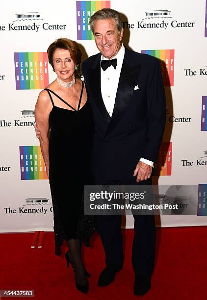 House minority leader Nancy Pelosi and husband Paul arrive at a special dinner for Kennedy Center honorees and guests at the State Department in...