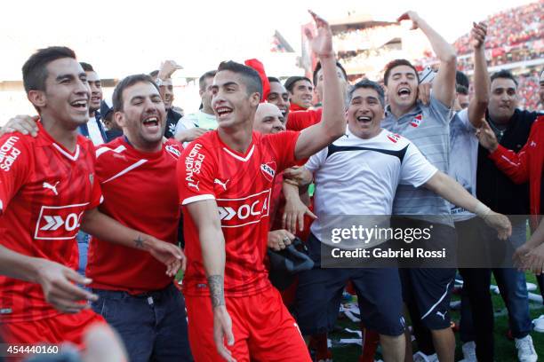 Players of Independiente celebrate after winning a match between Independiente and Racing as part of fifth round of Torneo de Transicion 2014 at...