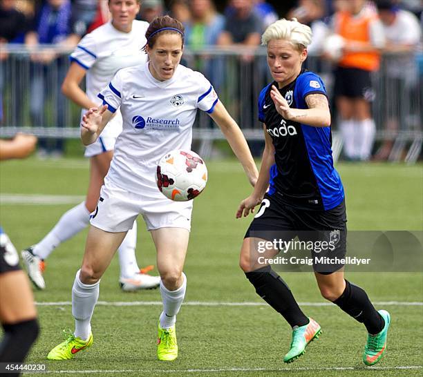 Elizabeth Bogus of FC Kansas City and Jessica Fishlock of Seattle Reign FC fight for the ball in the second half of the National Women's Soccer...