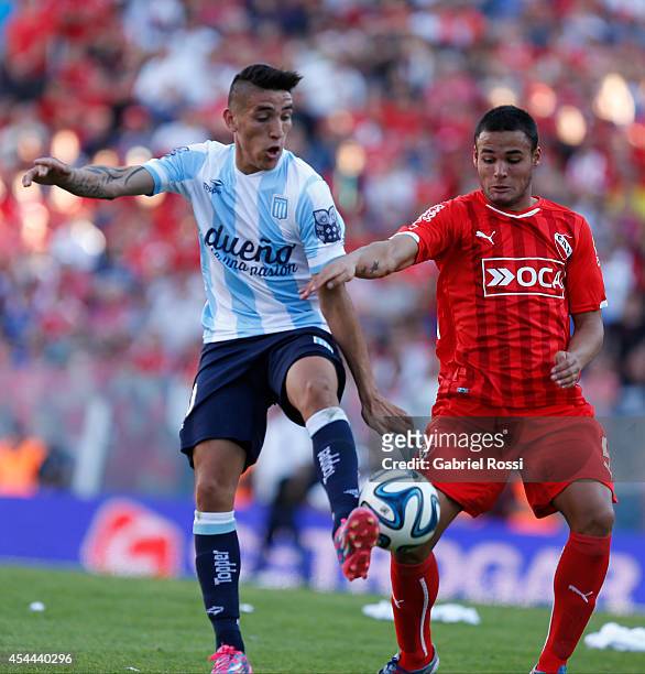 Ricardo Centurion of Racing Club fights for the ball with Nestor Breitenbruch of Independiente during a match between Independiente and Racing as...
