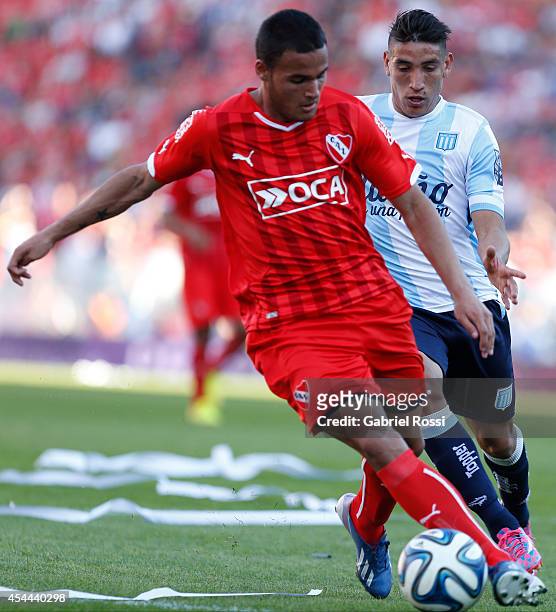 Nestor Breitenbruch of Independiente fights for the ball with Ricardo Centurion of Racing Club during a match between Independiente and Racing as...