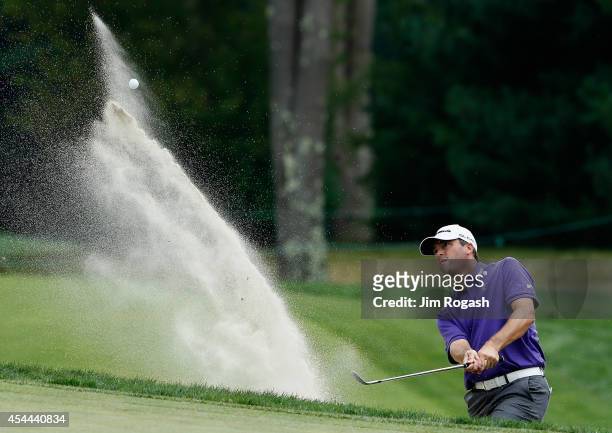 Ryan Palmer takes his shot out of the bunker on the seventh hole during the third round of the Deutsche Bank Championship at the TPC Boston on August...