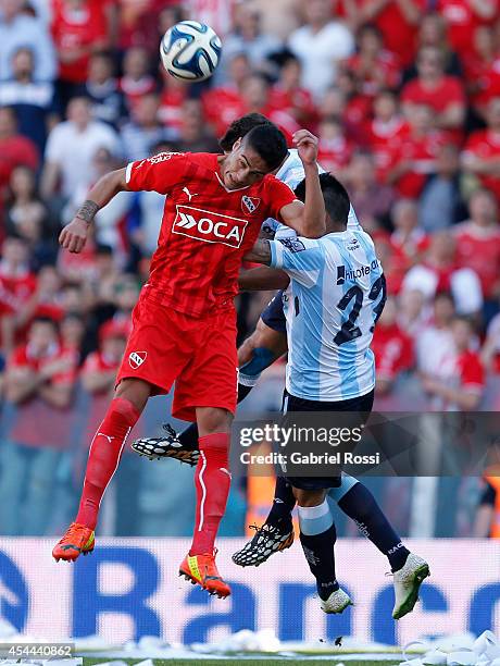 Jorge Figal of Independiente heads the ball during a match between Independiente and Racing as part of fifth round of Torneo de Transicion 2014 at...