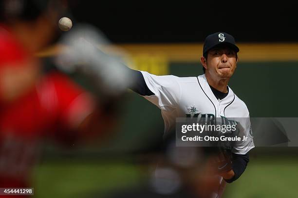 Starting pitcher Hisashi Iwakuma of the Seattle Mariners pitches in the fourth inning against the Washington Nationals at Safeco Field on August 31,...