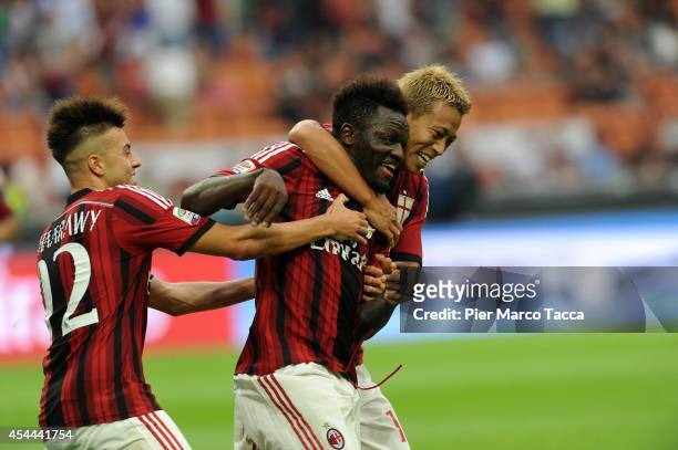 Stephan El Shaarawy, Sulley Ali Muntari and Keisuke Honda of AC Milan celebrate the goal of 2-0 during the Serie A match between AC Milan and SS...