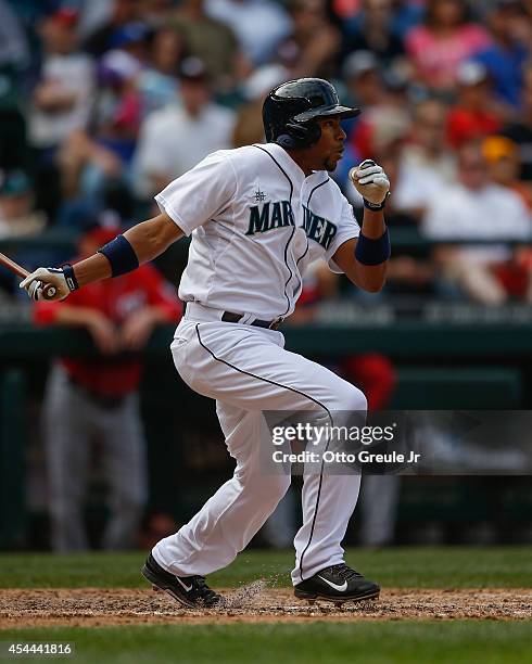 Endy Chavez of the Seattle Mariners hits an RBI double in the eighth inning against the Washington Nationals at Safeco Field on August 31, 2014 in...