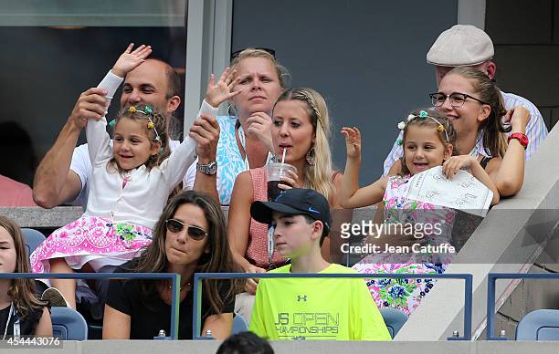 Myla Federer and Charlene Federer, Roger Federer's twins cheer for their during his match on Day 7 of the 2014 US Open at USTA Billie Jean King...