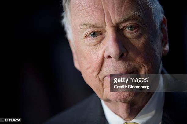 Bloomberg's Best Photos 2013: T. Boone Pickens, founder and chief executive officer of BP Capital LLC, sits for a photograph following a Bloomberg...
