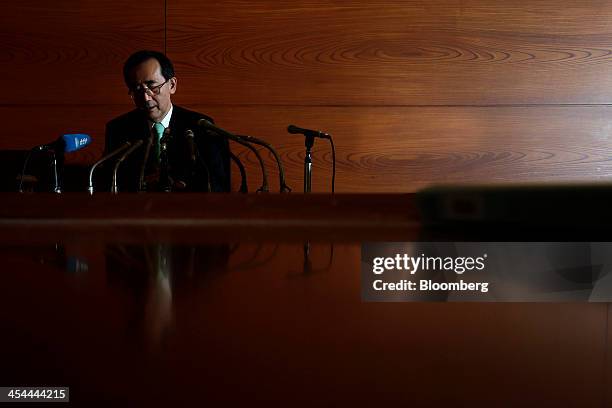 Bloomberg's Best Photos 2013: Masaaki Shirakawa, outgoing governor of the Bank of Japan, attends a news conference in this photograph lit with an...