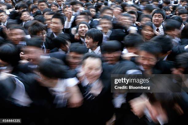 Bloomberg's Best Photos 2013: Vocational students sing in this long exposure photograph taken during a rally to start off job-hunting in Tokyo,...