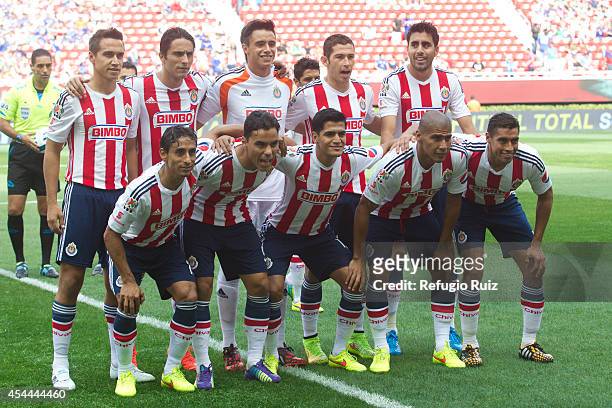 Players of Chivas pose for a group photo prior a match between Chivas and Cruz Azul a as part of Apertura 2014 Liga MX at Omnilife Stadium on August...