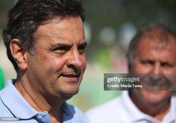 Presidential candidate Aecio Neves of the Brazilian Social Democracy Party speaks with Zico at a campaign soccer match at the Zico Football Center on...