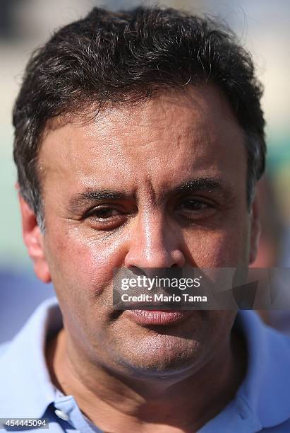 Presidential candidate Aecio Neves of the Brazilian Social Democracy Party speaks at a campaign soccer match at the Zico Football Center on August...