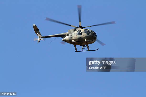Picture taken on December 8, 2013 shows a Kenyan military helicopter hovering over the restive town of Moyale in Marsabit county on Kenya's frontier...