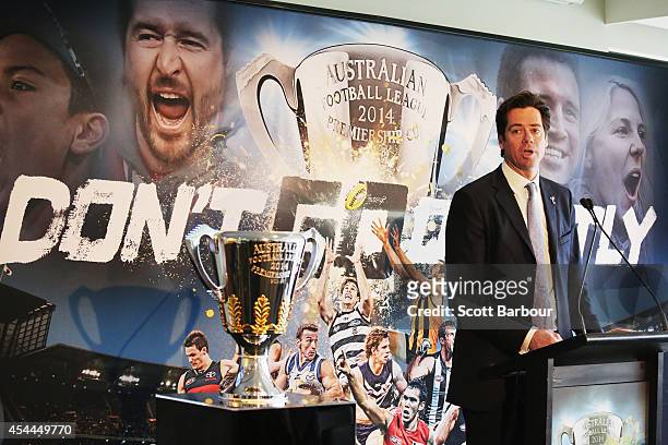 Gillon McLachlan speaks next to the 2014 AFL Premiership Cup during the AFL Premiership Cup handover on September 1, 2014 in Melbourne, Australia.