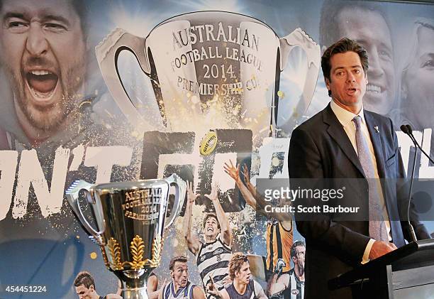 Gillon McLachlan speaks next to the 2014 AFL Premiership Cup during the AFL Premiership Cup handover on September 1, 2014 in Melbourne, Australia.