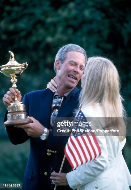 Ben Crenshaw, the non-playing captain of the United States team, with his wife Julie and the trophy after the United States team wins the Ryder Cup...
