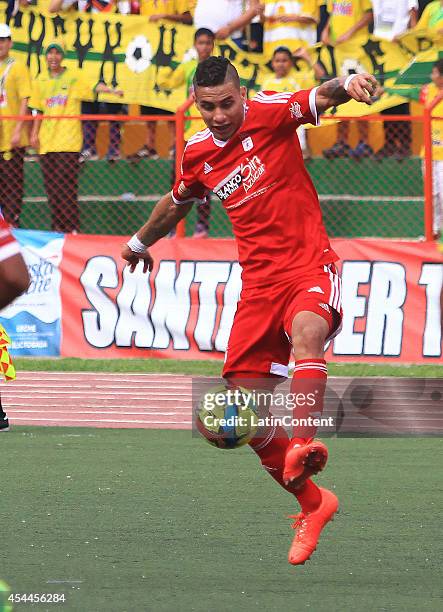 Bryan Urueña of America de Cali controls the ball during a match between America de Cali and Bucaramanga as part of Torneo Postobon 2014 - II at...