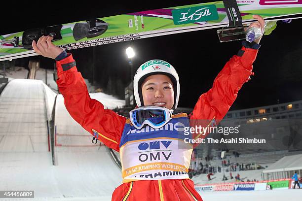 Sara Takanashi of Japan celebrates winning the FIS Nordic Combined World Cup Women's Ski Jumping HS100 on December 7, 2013 in Lillehammer, Norway.