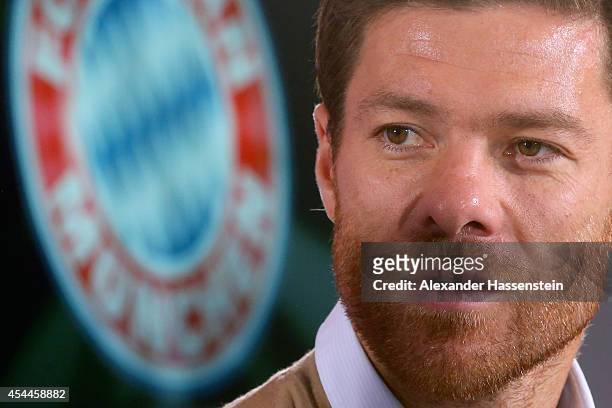 Xabi Alonso of FC Bayern Muenchen looks on during a press conference at Bayern Muenchen's headquarter Saebener Strasse on September 1, 2014 in...