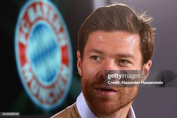 Xabi Alonso of FC Bayern Muenchen looks on during a press conference at Bayern Muenchen's headquarter Saebener Strasse on September 1, 2014 in...