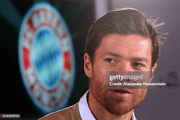 Xabi Alonso of FC Bayern Muenchen looks on during a press conference at Bayern Muenchen's headquarter Saebener Strasse on September 1, 2014 in...