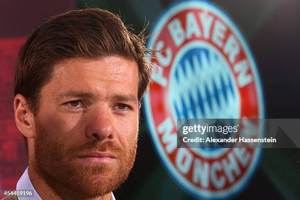 Xabi Alonso of FC Bayern Muenchen looks on during a press conference at Bayern Muenchen's headquarter Saebener Strasse on September 1, 2014 in...