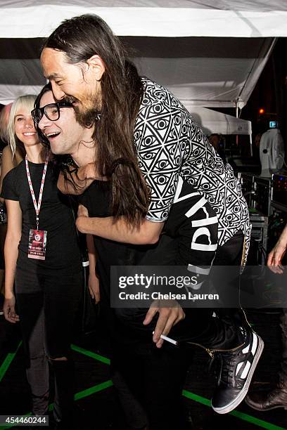 DJs Skrillex and Steve Aoki backstage during day 2 of the Made in America Festival at Los Angeles Grand Park on August 31, 2014 in Los Angeles,...