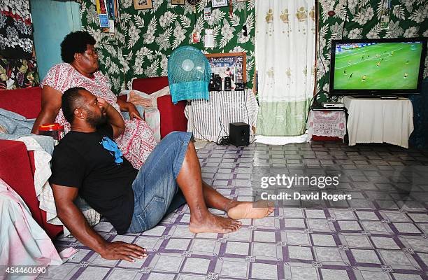 Vereniki Goneva of Leicester Tigers and Fiji relaxes at his family home with his mother, Melaia Nabewa, in the village of Nagado on June 24, 2014 in...