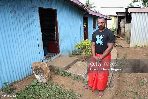 Vereniki Goneva of Leicester Tigers and Fiji, wearing a traditional Sulu, poses at his family home in the village of Nagado on June 24, 2014 in...