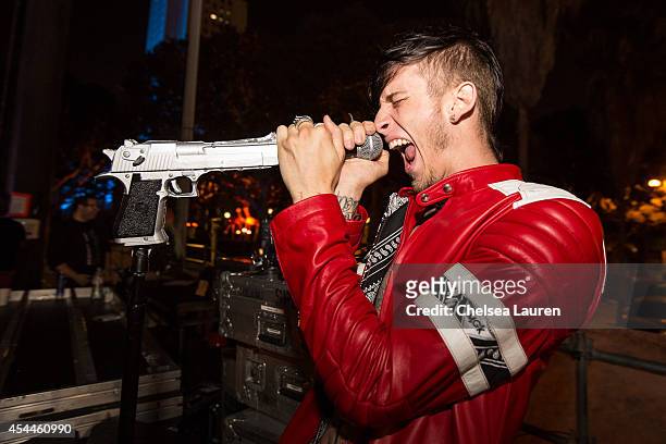Rapper Machine Gun Kelly poses backstage during day 2 of the Made in America Festival at Los Angeles Grand Park on August 31, 2014 in Los Angeles,...