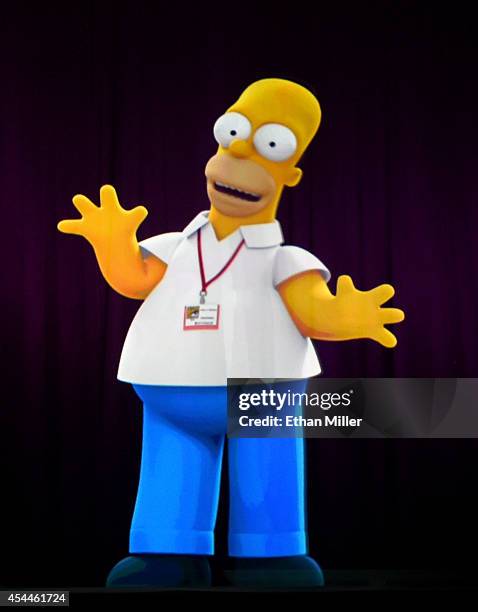 Projection of Homer Simpson is shown during FOX's "The Simpsons" panel during Comic-Con International 2014 at the San Diego Convention Center on July...