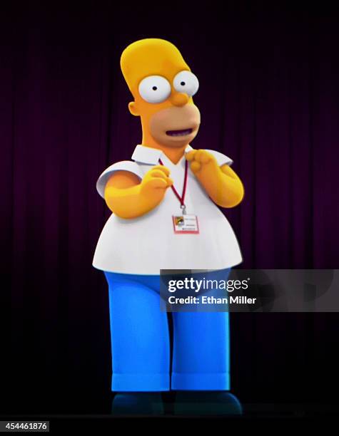 Projection of Homer Simpson is shown during FOX's "The Simpsons" panel during Comic-Con International 2014 at the San Diego Convention Center on July...