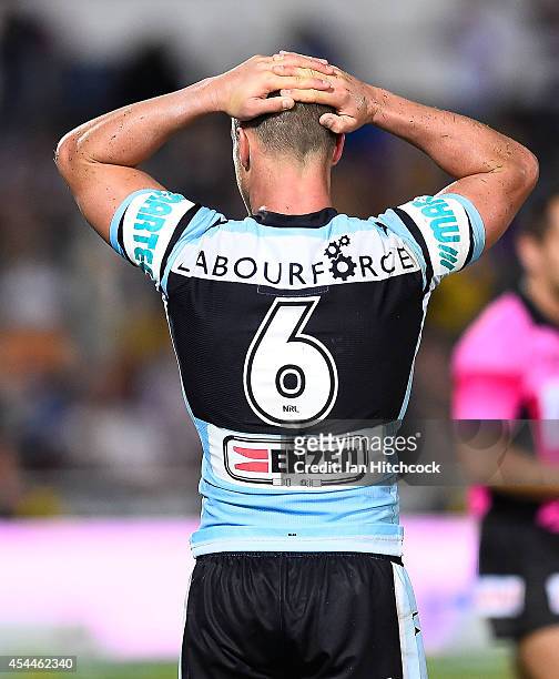Daniel Holdsworth of the Sharks looks dejected after losing the round 25 NRL match between the North Queensland Cowboys and the Cronulla Sharks at...