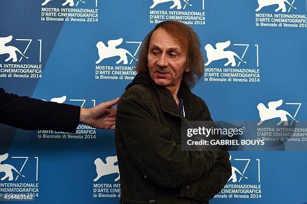 French writer Michel Houellebecq poses during the photocall of the movie "Near Death Experience" presented in the Orizzonti selection at the 71st...